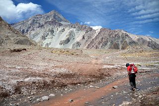 16 The Flat Riverbed Finally Gives Way To Green Hills With Cerro Almacenes Morro As The Trail Nears Confluencia On The Descent From Plaza de Mulas.jpg